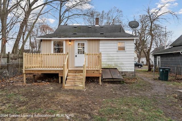 back of property featuring a deck