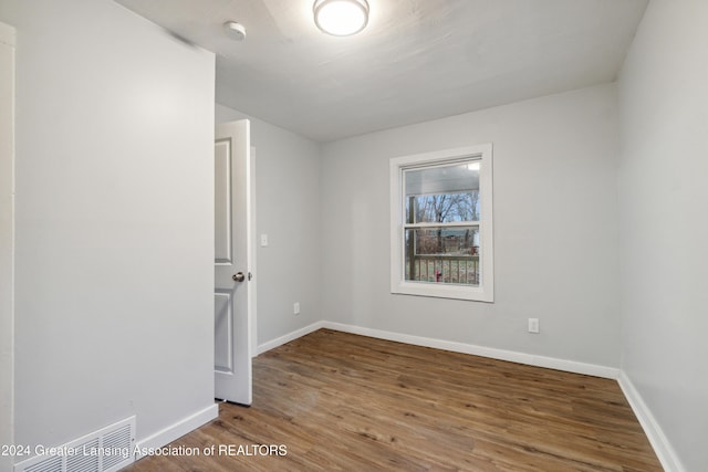 spare room featuring hardwood / wood-style floors