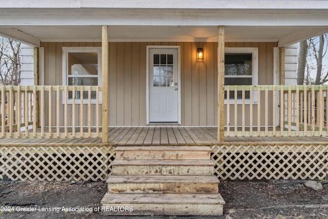 doorway to property with a porch