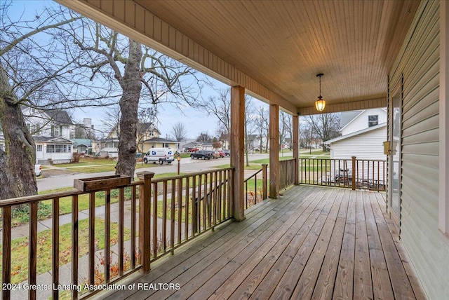 wooden terrace with a porch