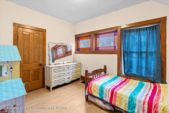 bedroom featuring a textured ceiling