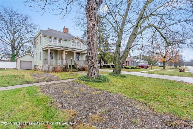 view of front of home featuring an outdoor structure, a front yard, a porch, and a garage