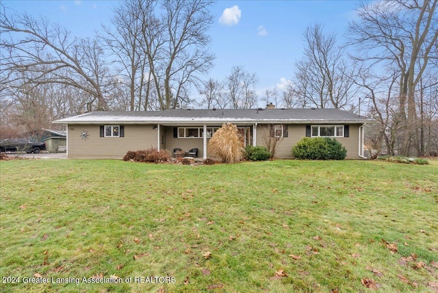 ranch-style house with a front lawn