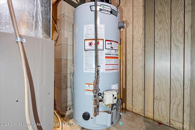 utility room featuring water heater