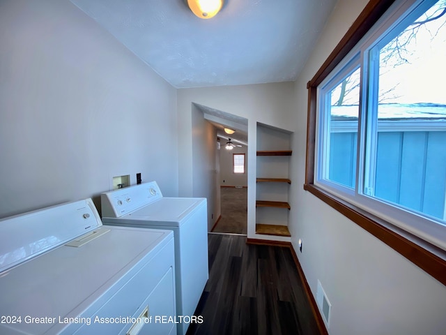 laundry room featuring separate washer and dryer, ceiling fan, and dark hardwood / wood-style floors