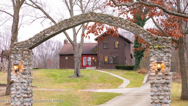 view of front of house featuring french doors and a front yard