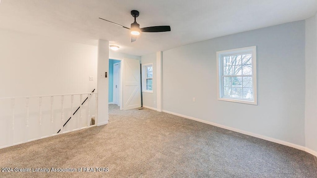 carpeted empty room with ceiling fan