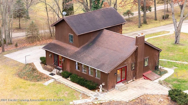 view of property exterior with a lawn