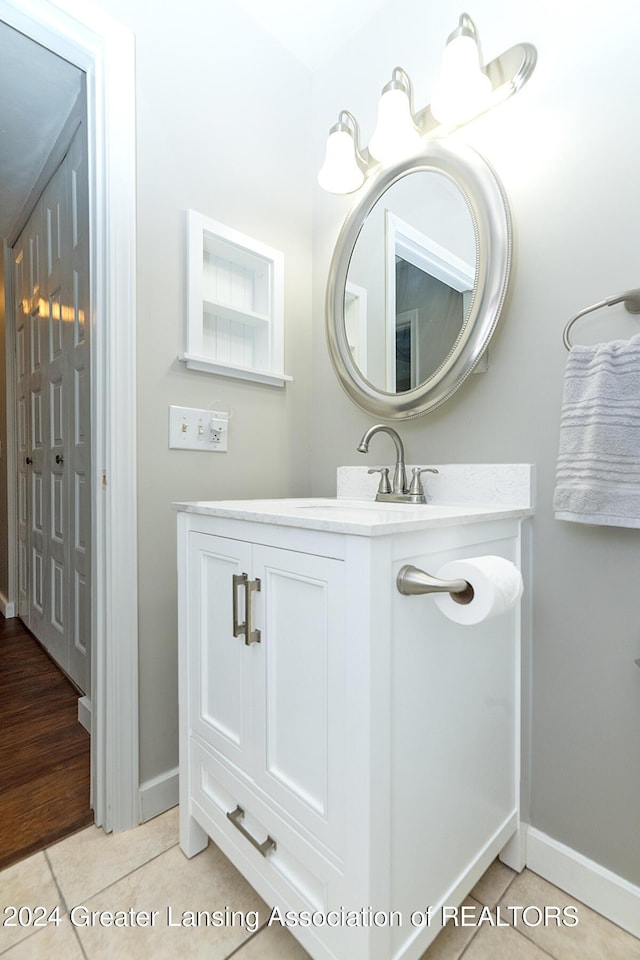 bathroom featuring tile patterned flooring and vanity