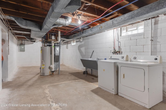 basement with separate washer and dryer, electric panel, gas water heater, and sink