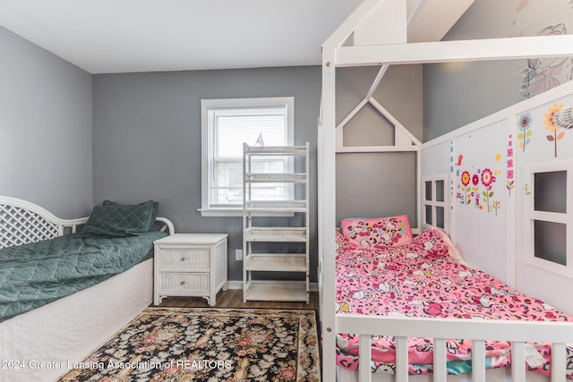 bedroom with hardwood / wood-style floors