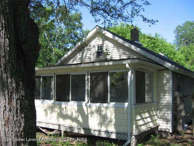 view of home's exterior featuring a sunroom