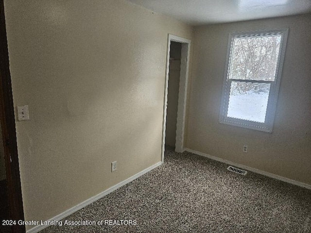 empty room featuring carpet flooring