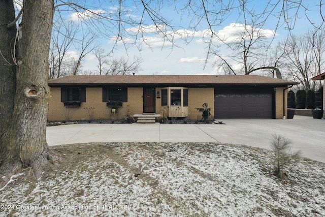 ranch-style house featuring a garage