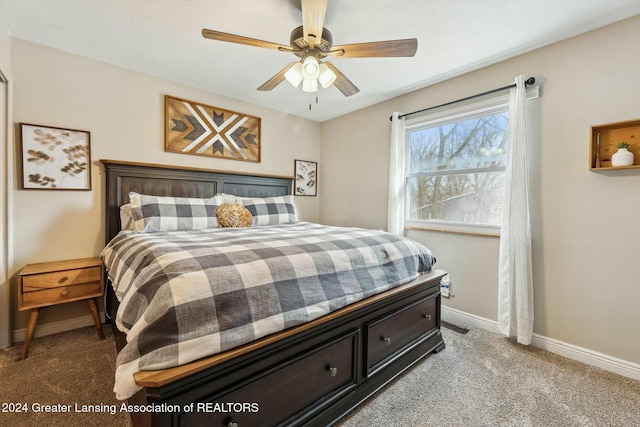 carpeted bedroom with ceiling fan