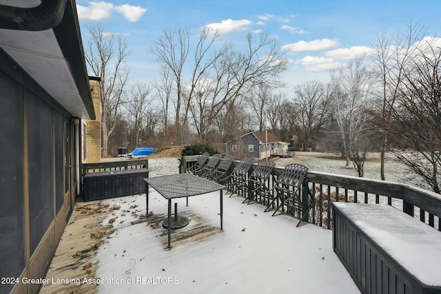 view of snow covered deck