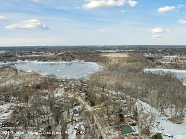 snowy aerial view featuring a water view