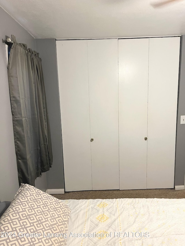 unfurnished bedroom with carpet flooring