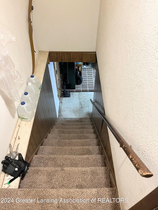 stairs featuring concrete floors