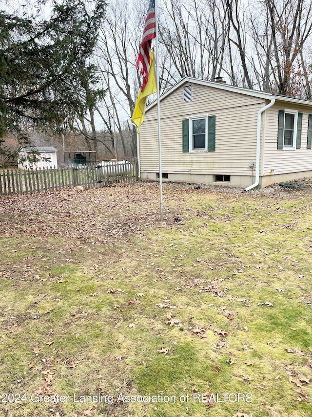 view of property exterior featuring a yard