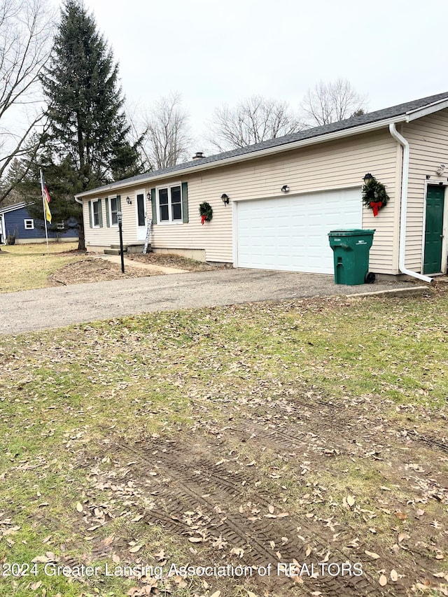 single story home with a garage