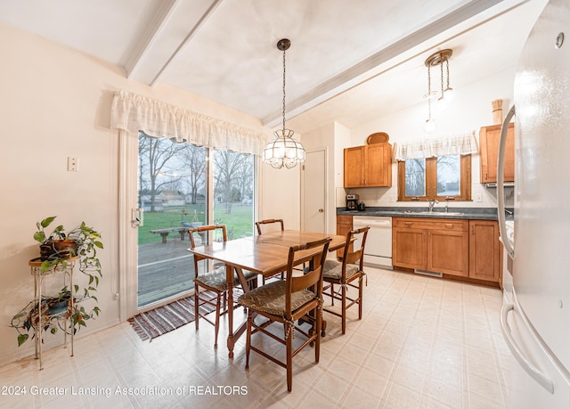 dining space with vaulted ceiling with beams, sink, and an inviting chandelier