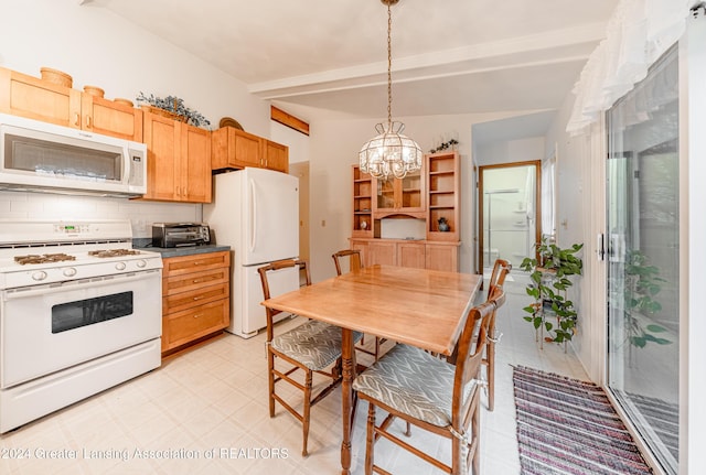 kitchen with an inviting chandelier, backsplash, lofted ceiling, decorative light fixtures, and white appliances