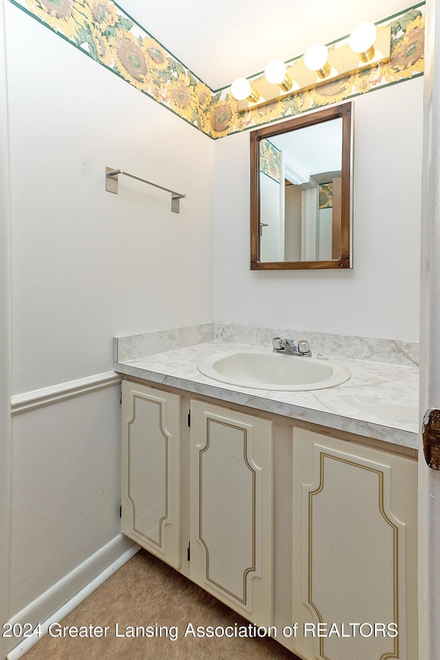 bathroom featuring tile patterned flooring and vanity