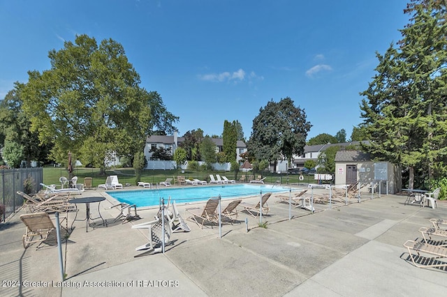 view of swimming pool featuring a patio area