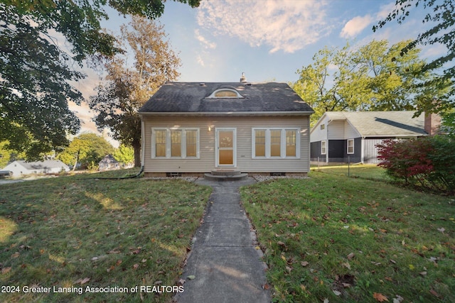 view of front of house with a yard