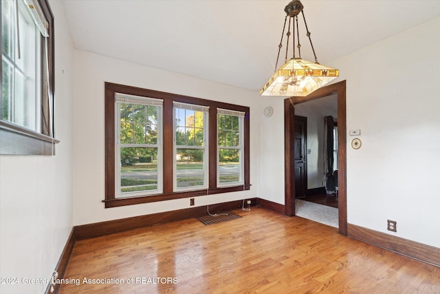 unfurnished room featuring light wood-type flooring