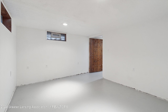 basement with a textured ceiling