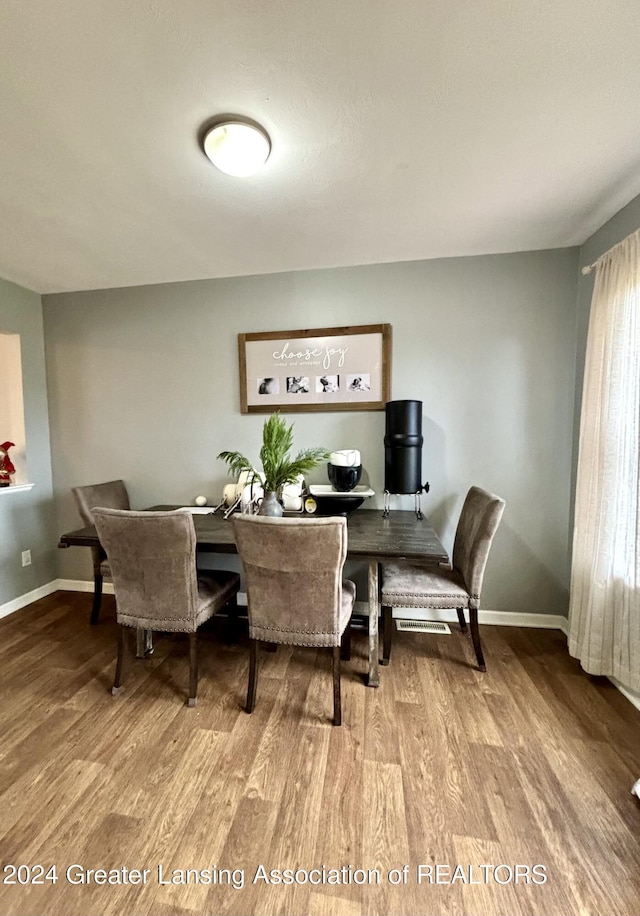 dining room featuring wood-type flooring