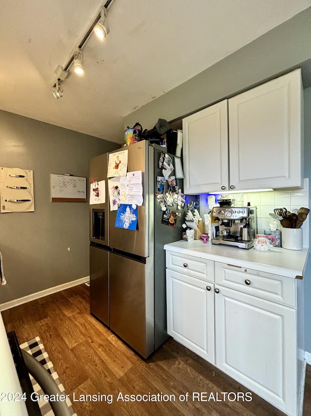 kitchen with white cabinets, stainless steel fridge, dark hardwood / wood-style flooring, and track lighting