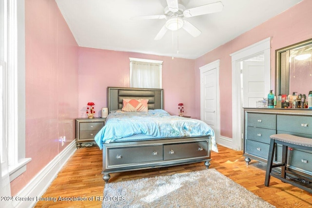 bedroom featuring light wood-type flooring and ceiling fan