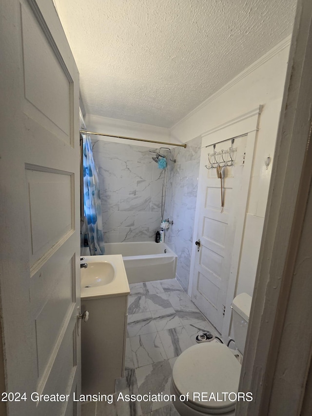 full bathroom with vanity, shower / bath combo, a textured ceiling, and toilet