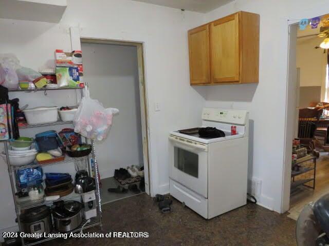 kitchen with white electric range oven and ceiling fan