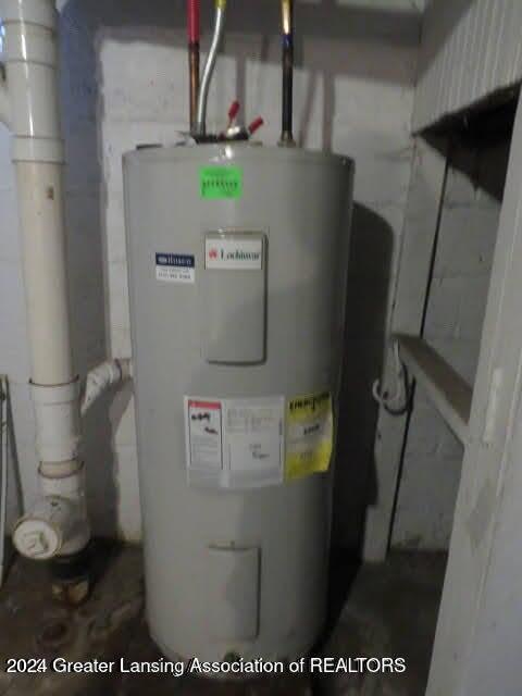 utility room featuring electric water heater