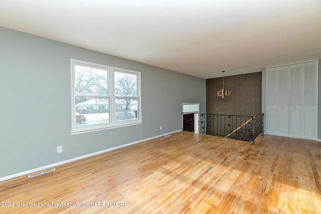 unfurnished living room with hardwood / wood-style flooring