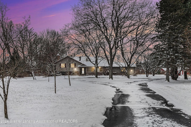 view of yard layered in snow