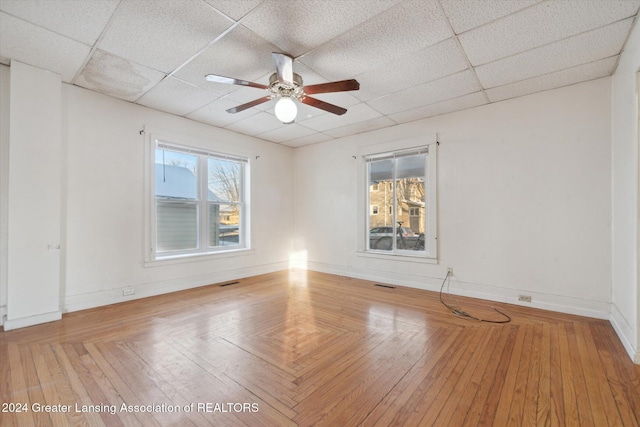 spare room with a paneled ceiling and ceiling fan