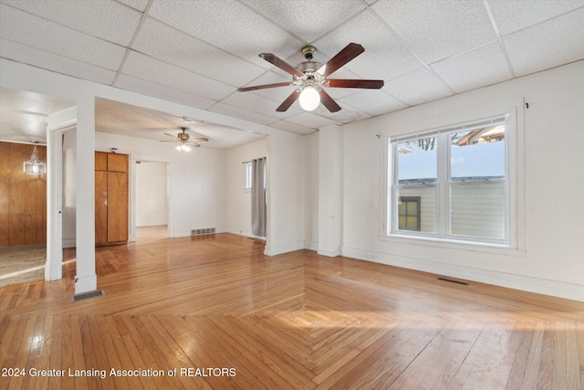 spare room featuring parquet flooring, a paneled ceiling, and ceiling fan