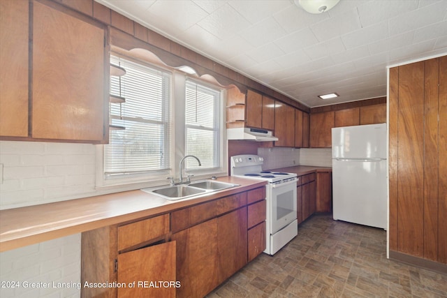 kitchen featuring white appliances and sink