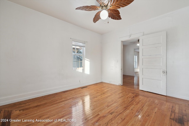 empty room with hardwood / wood-style flooring