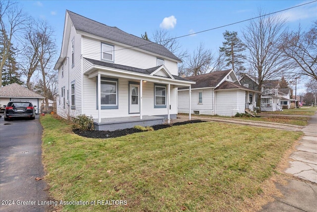 view of front of house featuring covered porch and a front yard