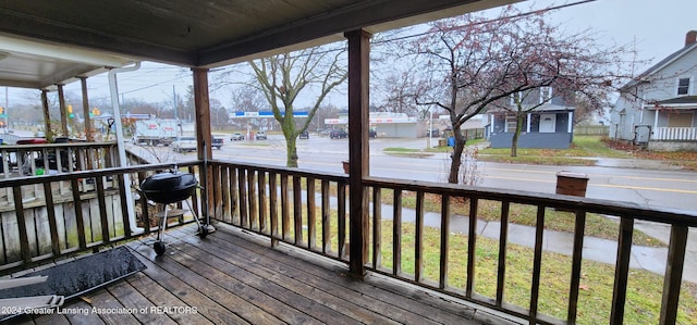 wooden terrace with covered porch and grilling area