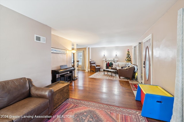 living room with dark hardwood / wood-style flooring