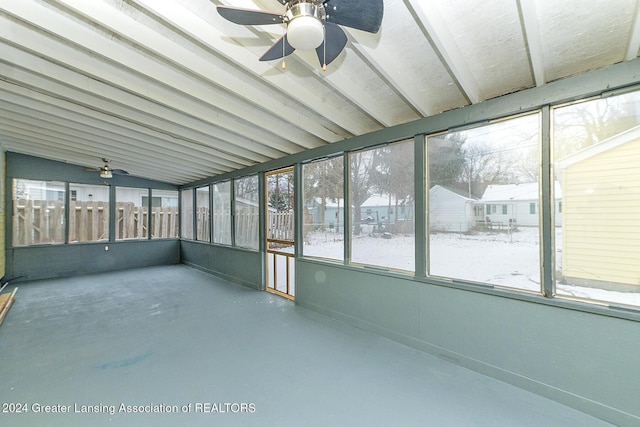 unfurnished sunroom featuring ceiling fan and lofted ceiling