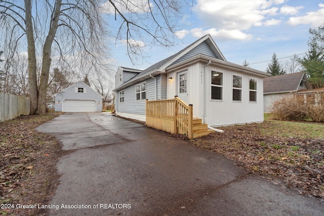 view of property exterior featuring an outbuilding and a garage