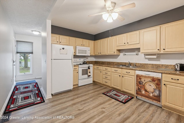 kitchen with white appliances, sink, ceiling fan, light wood-type flooring, and a textured ceiling